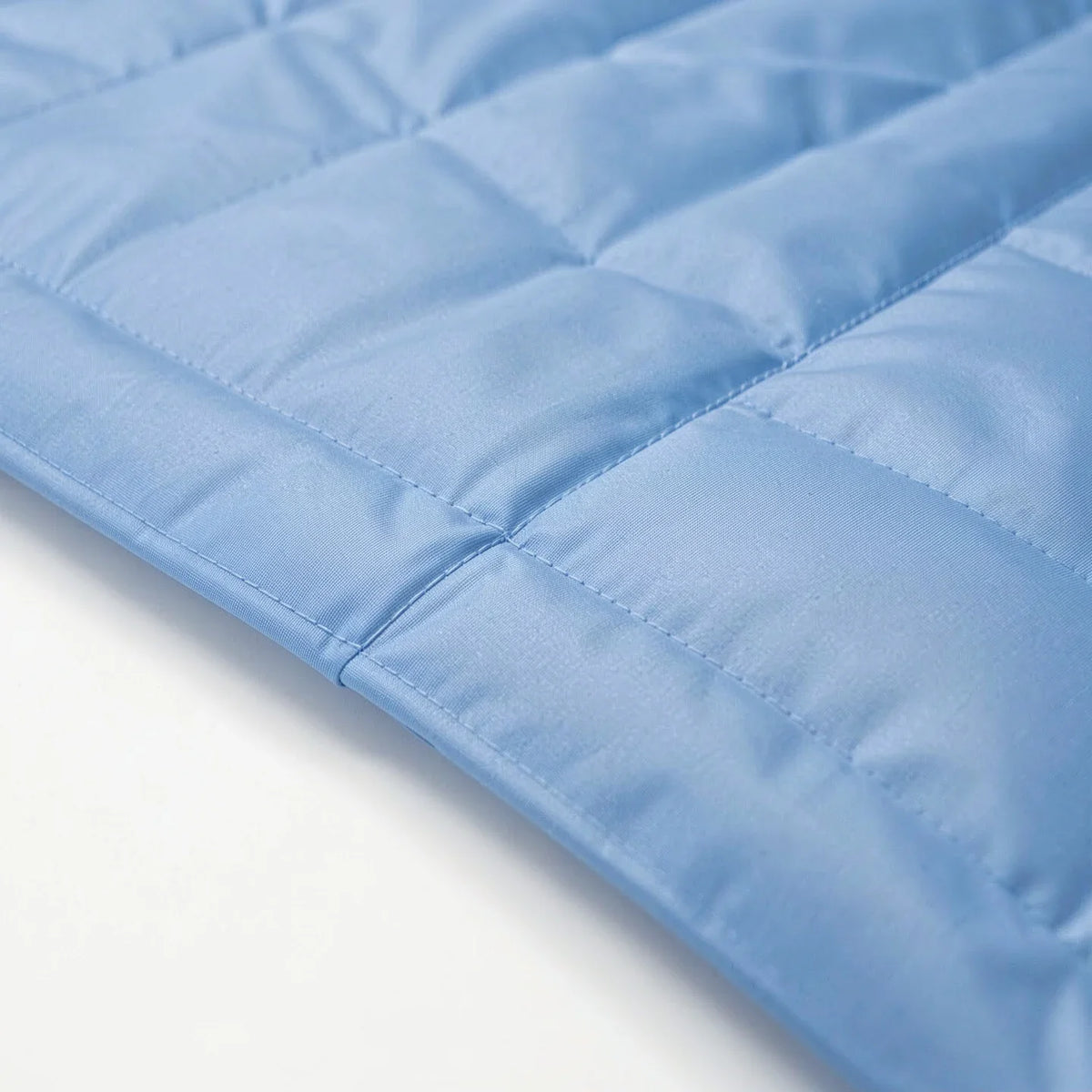Close-up of a cooling mat's wipe-clean surface